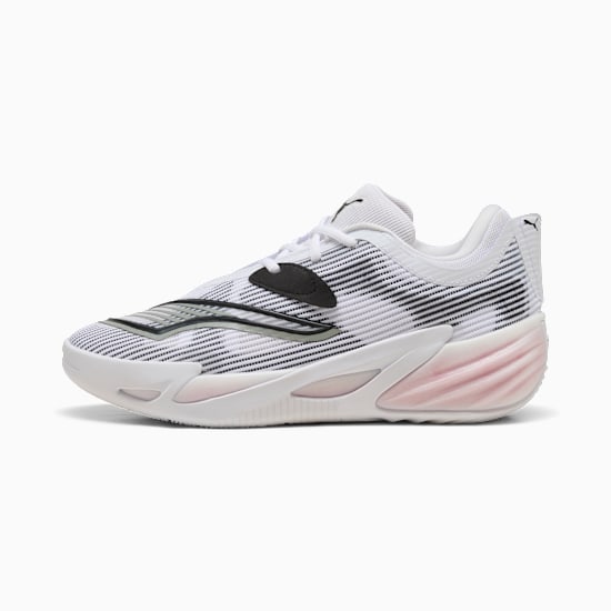 White PUMA trainers with black accents and a textured, pink-tinted sole.