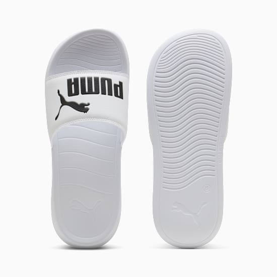 White PUMA slide, adult, with black logo band and textured sole.