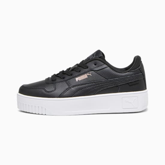 Black PUMA trainer, women's, with a thick white sole and subtle logo detailing.