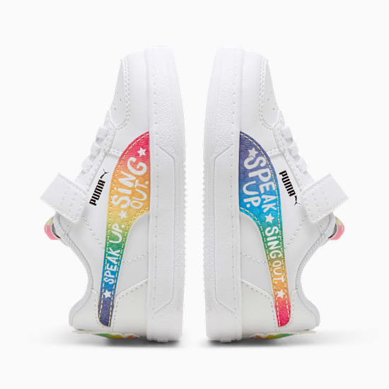White PUMA trainers for kids with 'Speak Up, Sing Out' rainbow design.