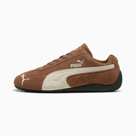 Scarpa unisex marrone PUMA con striscia bianca e design a basso profilo.
