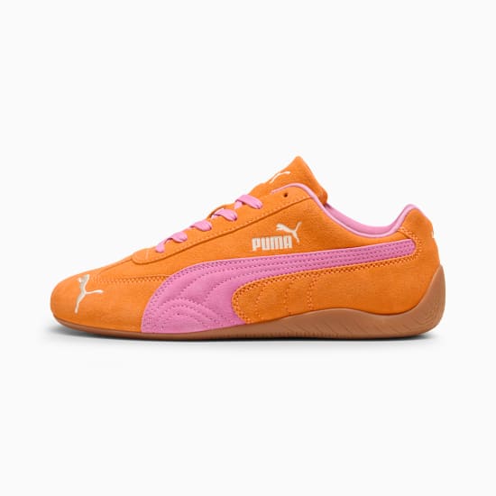 Orange PUMA sneaker shows pink formstrip, laces, and lining detail.