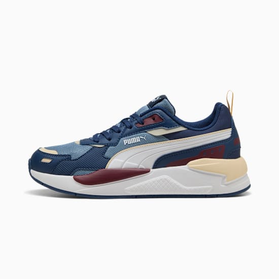 Blue PUMA trainer, adult size, with white stripe and layered sole design.