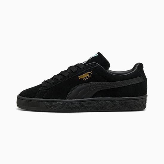 Black PUMA Suede unisex trainer with lace-up closure and rubber sole.