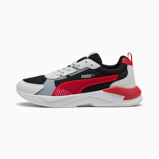 Black PUMA trainer, adult size, featuring red stripes and a white sole.