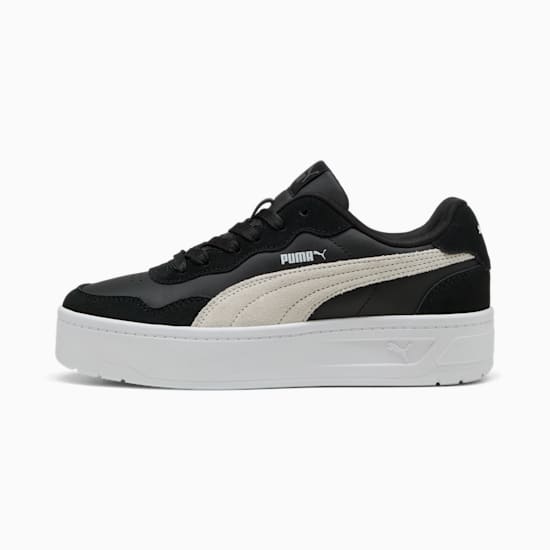 Black PUMA trainer, for adults, with a white formstrip and a thick white sole.
