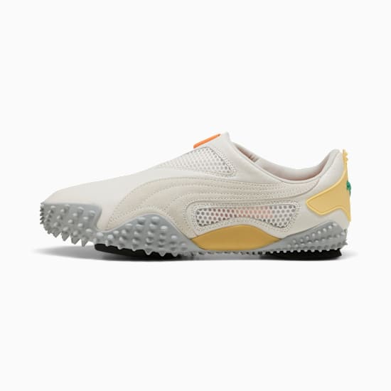 Off-white PUMA trainers with a textured grey sole and yellow accents for adults.