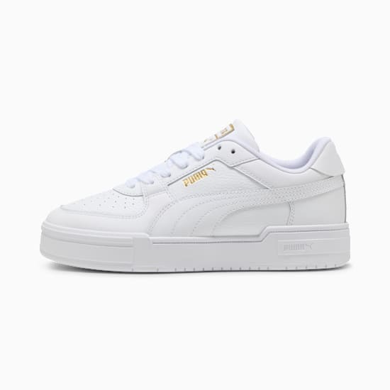 White PUMA trainers for adults with gold logo and lace-up fastening.