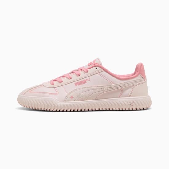 Pink PUMA trainer for youth, featuring suede accents and a textured sole.