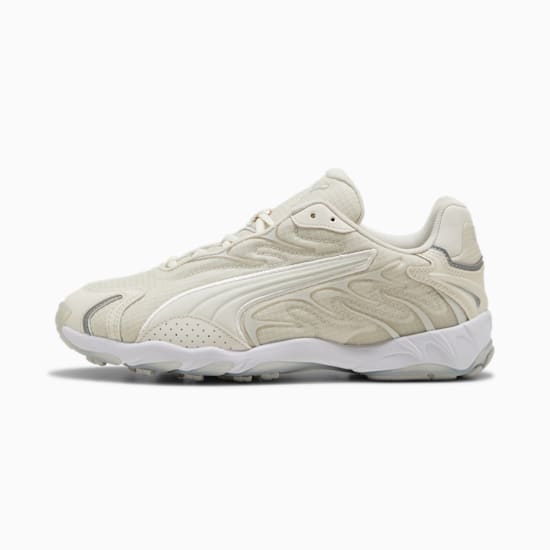 Beige PUMA damessneaker met getextureerd bovenwerk en witte zool.