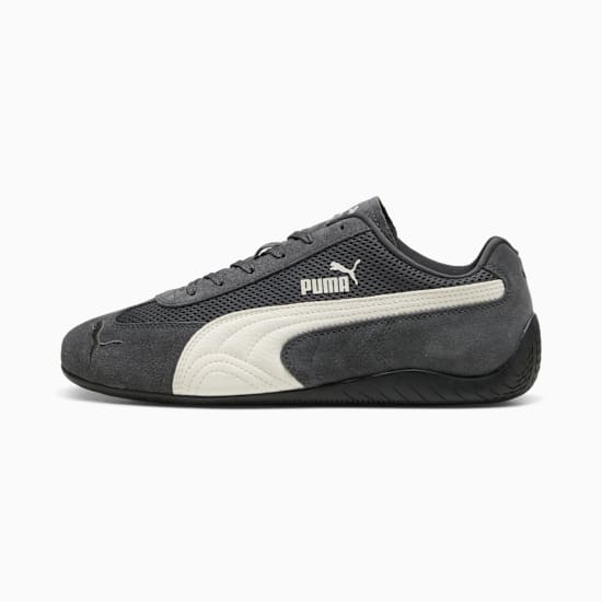 Scarpa grigia PUMA da uomo con striscia bianca e logo PUMA sul lato.