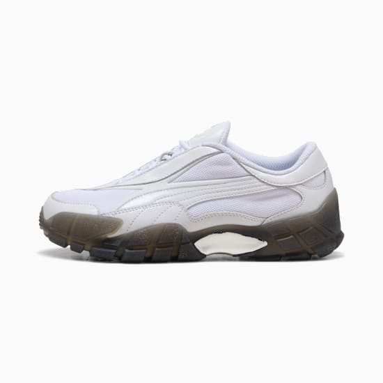 White PUMA trainers for adults, featuring a translucent dark grey sole and lace-up fastening.