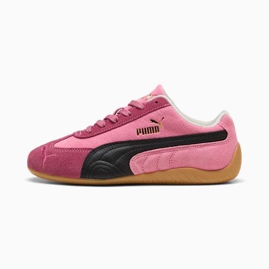 Pink PUMA sneaker for adults, featuring a black stripe and lace-up design.
