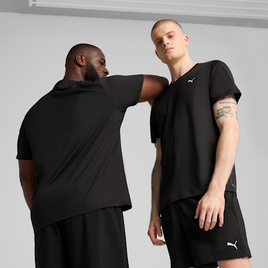 Two models pose in black sportswear against a grey backdrop.