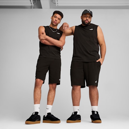 Two models pose in black sleeveless shirts, shorts and trainers against a grey backdrop.