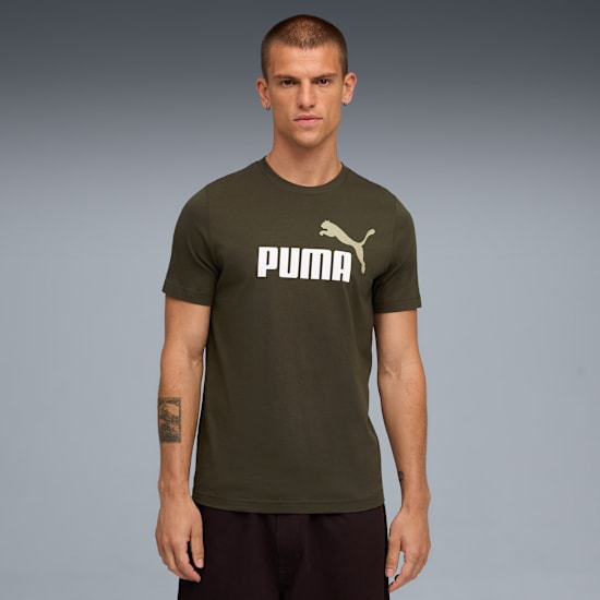 A model stands against grey, wearing an olive t-shirt with a white Puma logo and dark shorts.