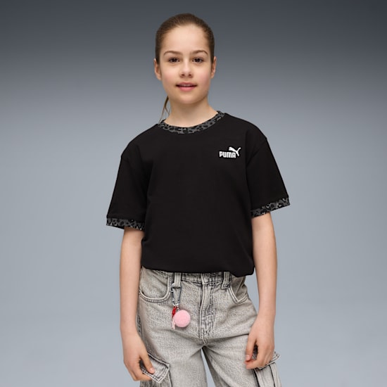 A model stands against grey wearing a black Puma t-shirt and light grey cargo trousers.