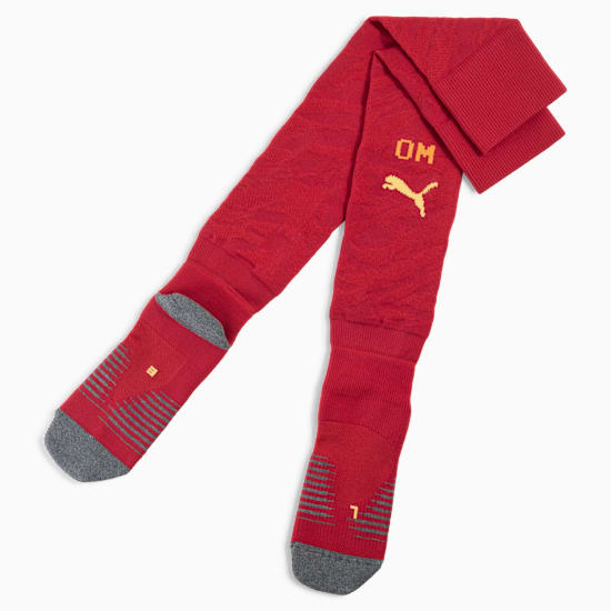 Red PUMA football socks with 'OM' detail and grey foot section.