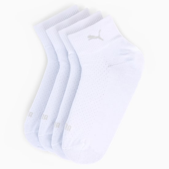 White PUMA sports socks for adults, featuring a breathable, dotted texture.
