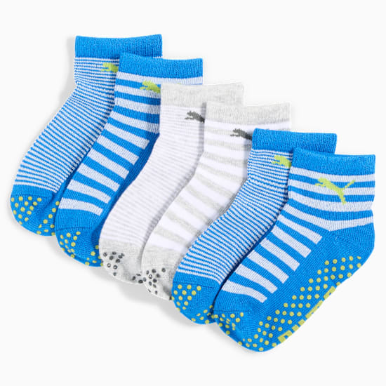 Striped PUMA socks for kids, some blue with grips, some grey, all with logo.