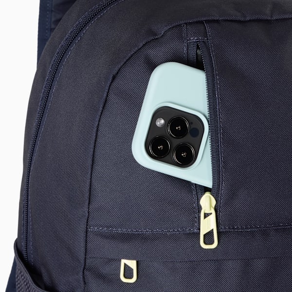 Navy PUMA rucksack showing a phone in a zipped pocket with yellow zip.