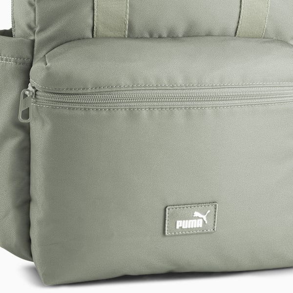 Grey PUMA women's backpack with zip pocket and logo patch.