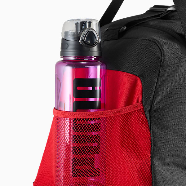 Black PUMA bag with a pink bottle in the red mesh side pocket.