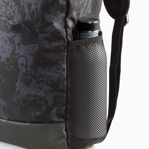 Patterned PUMA backpack with a side mesh pocket holding a water bottle.