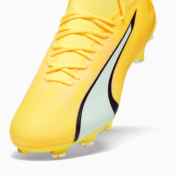Neon yellow soccer cleats top