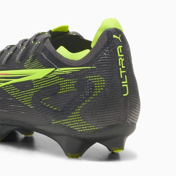 Grey PUMA football boot with neon green accents and 'ULTRA' branding.