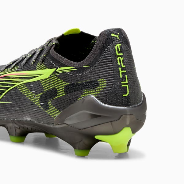 Black PUMA football boot with neon green accents and 'ULTRA' text.