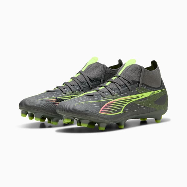 Grey PUMA football boots with neon green and pink detailing for adults.