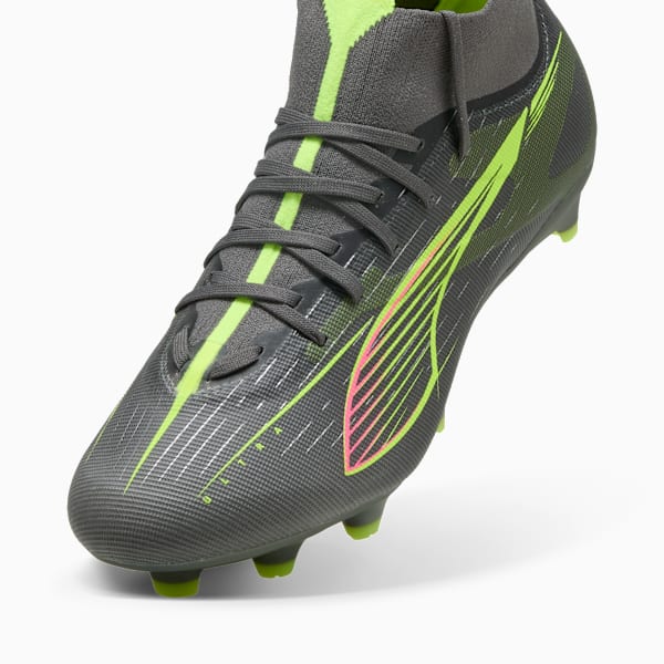 Grey PUMA football boot with neon green and pink accents, laces, and elevated sock-like fit.