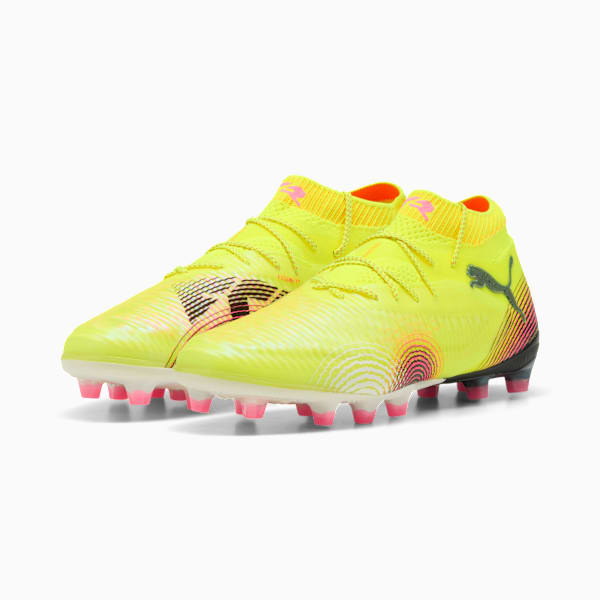 Yellow PUMA football boots, unisex, with a high collar and pink stud details.