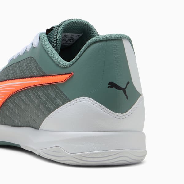 Green PUMA trainers, adult, with orange stripe and white sole detail.