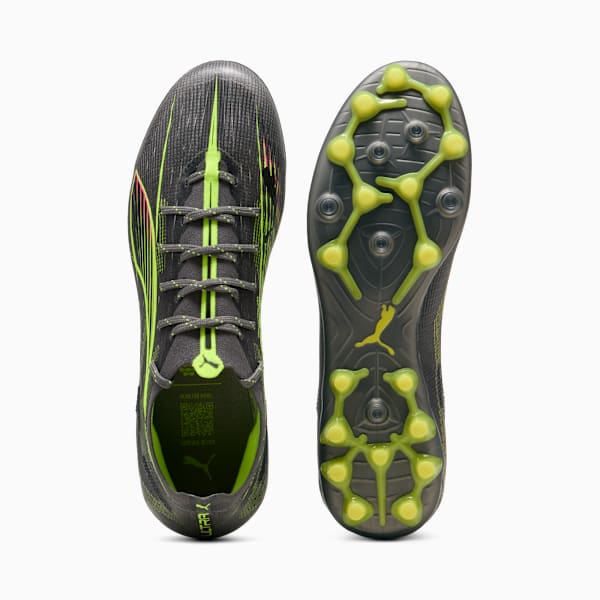 Grey PUMA football boots with neon green details and a studded sole.