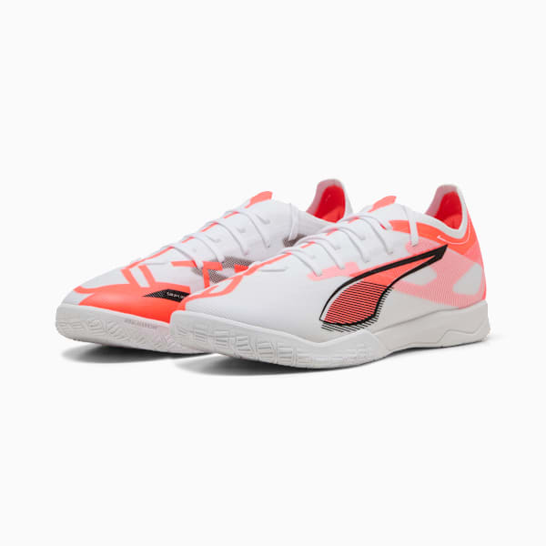 White PUMA indoor shoes with coral accents and a black logo for adults.