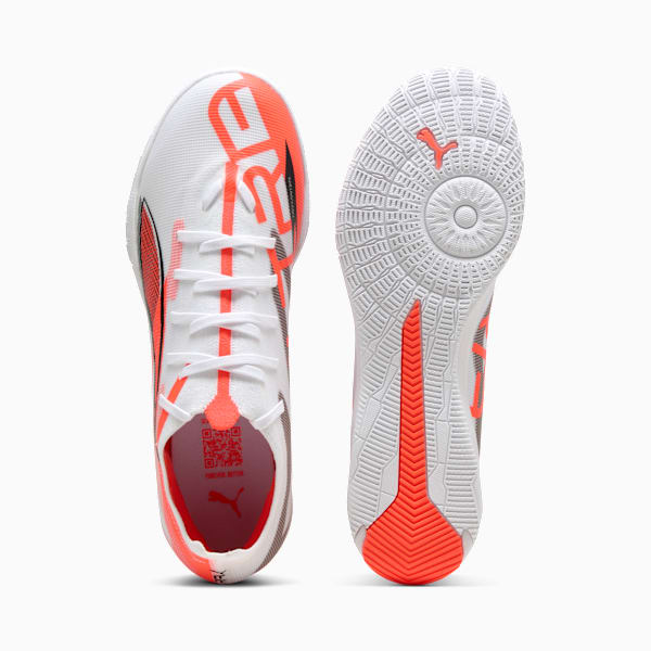 White PUMA indoor shoes with orange detailing for adults, shown from above and sole.