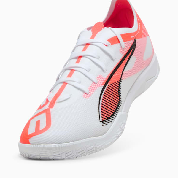 White PUMA adult's indoor shoe with coral accents and a black logo stripe on the side.