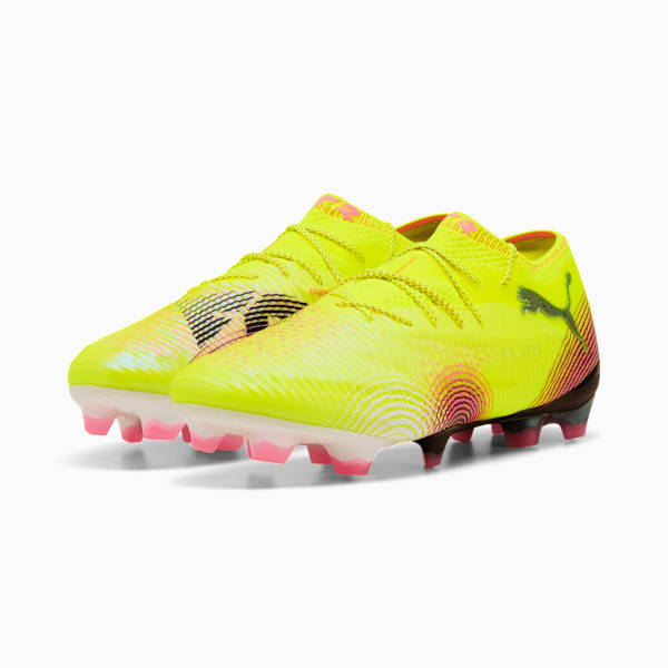 Yellow PUMA football boots with laces and patterned sole for adults.