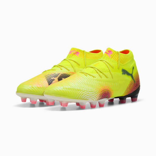 Yellow PUMA adult football boots with pink stud tips and a high sock-like ankle.