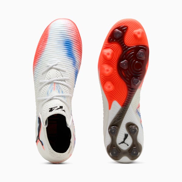 White PUMA adult boot with red, blue details and textured sole.