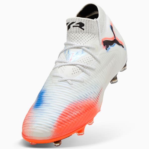 White PUMA football boot with blue and red accents and lace-up fastening.