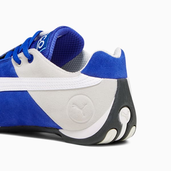 Blue puma racing shoes