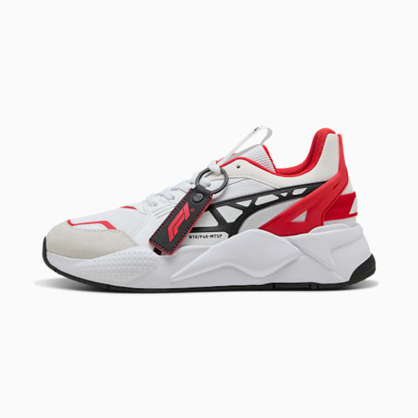 White PUMA trainer for adults with red and black accents and a branded tag.