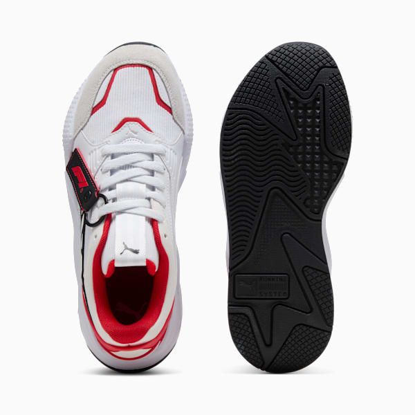White PUMA trainers show laces and sole with black and red accents.