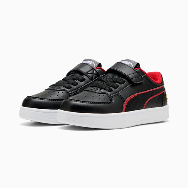Black PUMA trainers for kids with red accents and a touch-fastening strap.