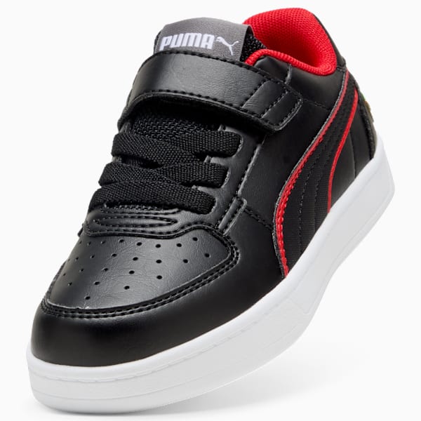 Black PUMA kids' trainer with red lining, white sole, and a hook-and-loop strap.