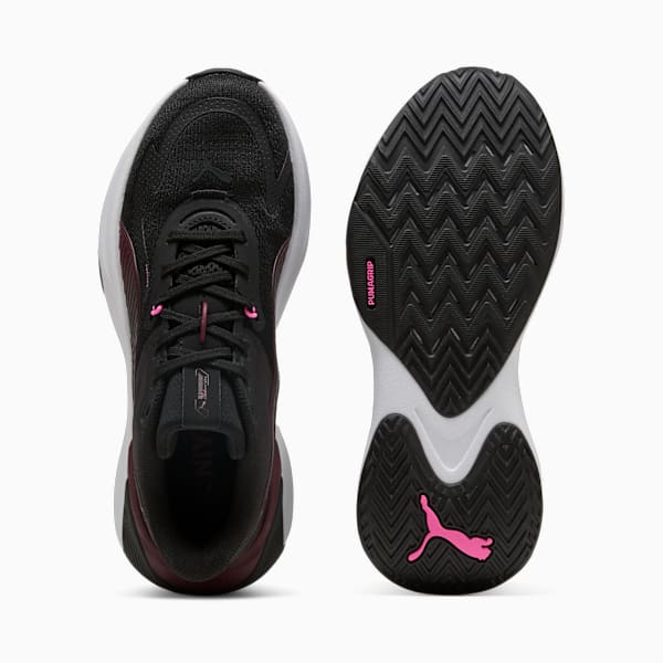 Black PUMA trainers for adults, showcasing a patterned sole and lace-up design.
