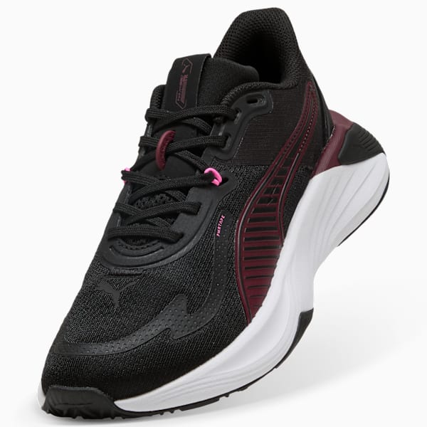Black PUMA trainers for adults with burgundy stripes and a white sole.